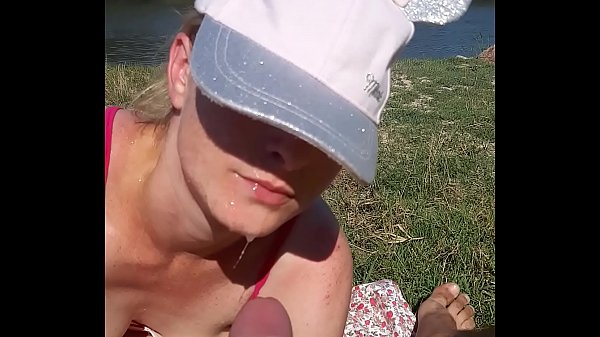 His wife sucks his dick while on the beach to tan his skin. The wife was scared because she was in public and she was scared not to be seen by others.