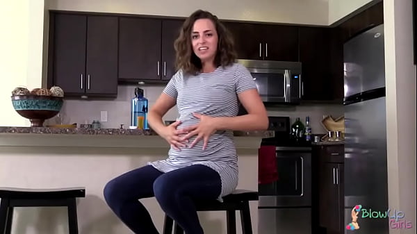 A stunning belly expansion of the hot pregnant woman.