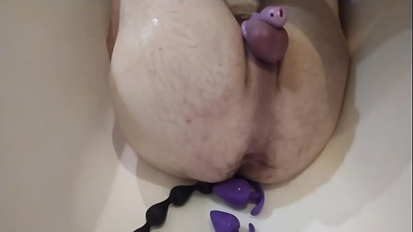 Big hairy ass, plugs, dildo, caged cumshot without hands