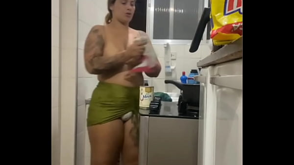 DOING LIVE IN THE KITCHEN IN A MINI SKIRT SHOWING HER FAT PUSSY